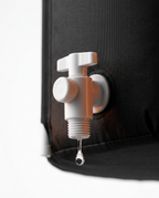 Close-up of the white quick-drain valve dripping on the ice bath tub