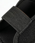 Macro of the adjustable woven elastic strap on the heel cushion