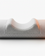 Macro of the curved ergonomic neck indent on the cylindrical traction pillow