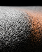 Close-up of the breathable woven fabric on the lumbar sleep cushion