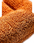 Macro of the plush terry fabric texture of the hand relaxation cushion