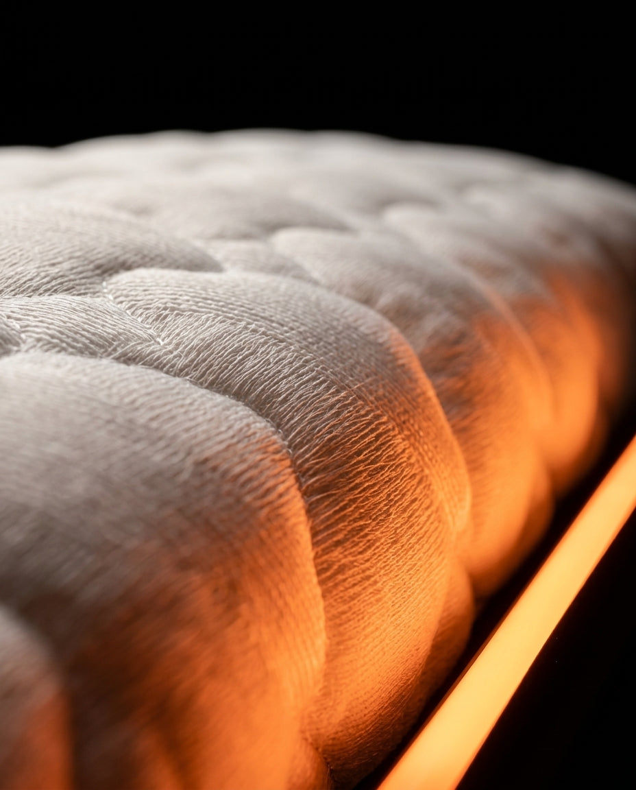 Close-up of the soft silk-touch quilted fabric of the support pillow