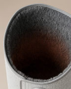Close-up of the soft dark felt interior lining of the leg warmer