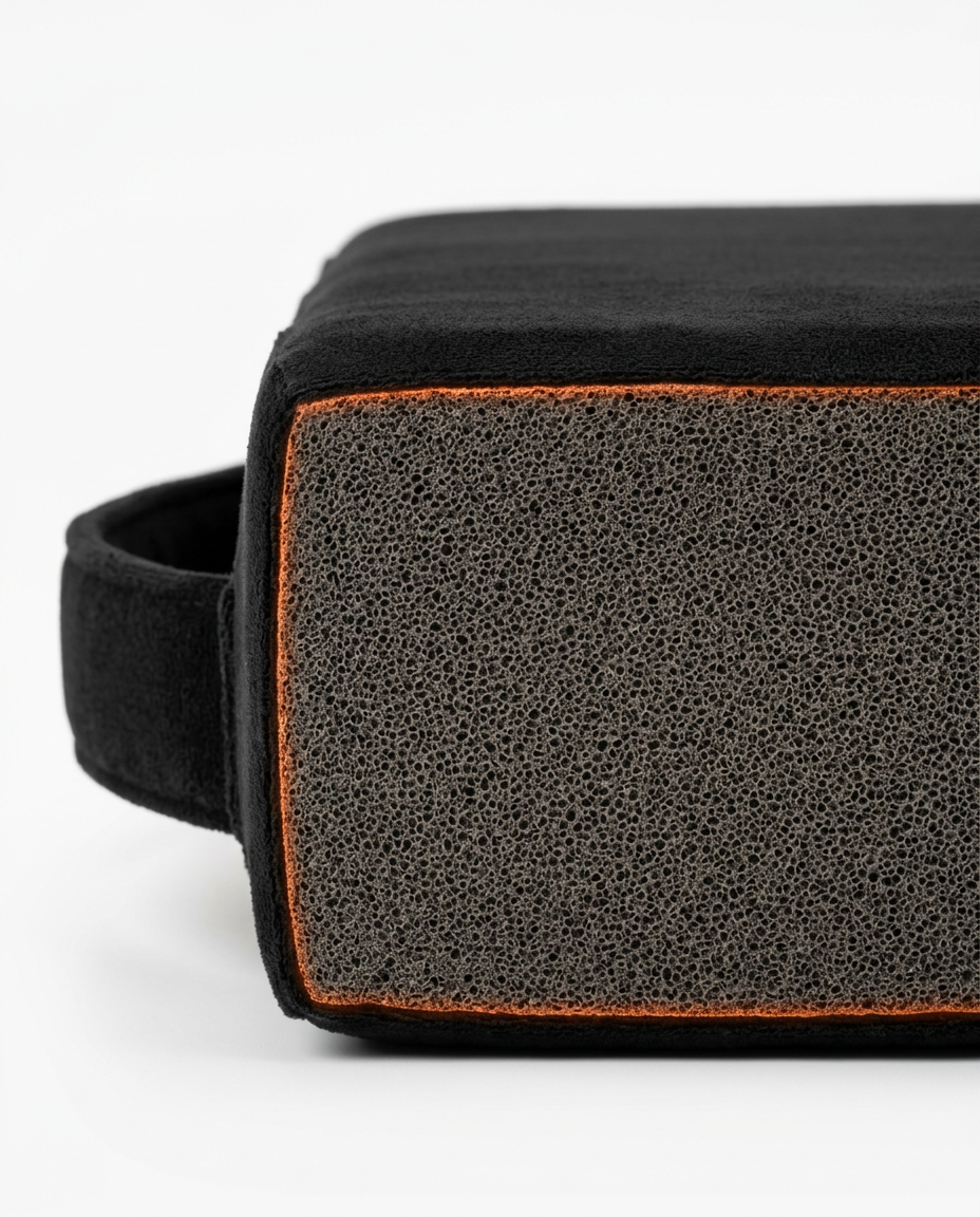 Exposed high-density foam core edge of the kneeling cushion, macro detail