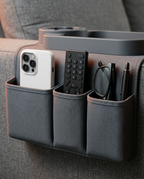Front pockets of the organizer holding a phone, remote, glasses and pens