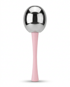 Macro of a single roller's steel ball head and contoured pink silicone handle