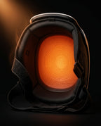 Inside of the knee massager glowing orange showing the heating element pad