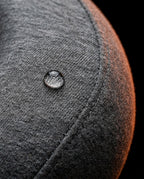 Water droplet beading on the grey jersey cover of the travel neck pillow