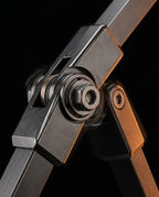 Macro of the phone arm's metal articulating joint with hex-bolt pivot