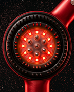 Macro of the comb head showing red LEDs between the silicone bristles