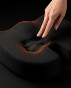 Finger pressing the seat cushion to show the slow-recovery memory foam