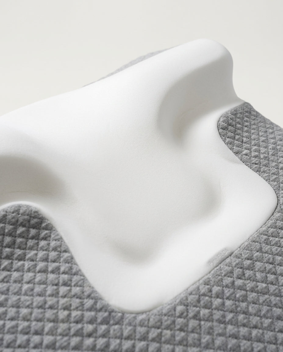 Close-up of the contoured white memory foam neck cradle recess