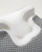 Close-up of the contoured white memory foam neck cradle recess