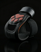 Single black paw lifting grip upright showing orange paw pad and open palm