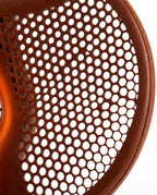 Macro of the saddle's perforated breathable mesh and stitched brown leather
