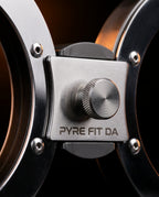 Central steel pivot mechanism with knurled adjustment knob joining the rings