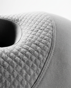 Macro of the diamond quilting stitch on the grey ear pillow cover