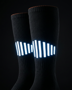 Close-up of the bright reflective safety stripes on the black heated socks