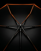 Underside of the open umbrella showing the black six-rib metal frame