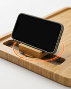 Phone standing in the 360-degree rotating slot of the bamboo arm tray