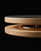 Close-up of the rotating pivot mechanism between the two wooden discs