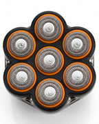 Top-down macro of the seven rotary blade heads with orange rings on the shaver