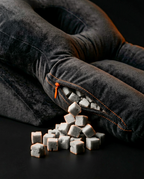 Shredded memory foam cubes spilling from the unzipped support pillow