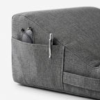 Macro of the side pocket holding glasses and a pen on the lap pillow