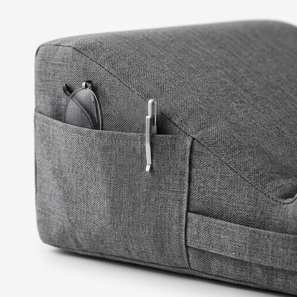 Macro of the side pocket holding glasses and a pen on the lap pillow