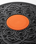 Macro of the orange non-slip silicone grip pad at the board's center