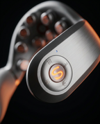 Close-up of the brushed-metal smart control disc on the neck massager