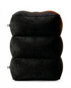 Side view of the triple-chamber stacked design of the black inflatable footrest