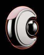 Studio shot of the chrome facial reset tool with pink trim glowing on black