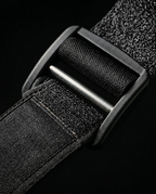 Close-up of the adjustable Velcro strap and buckle on the shoulder wrap