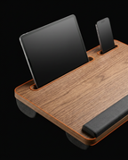 Tablet and phone propped in the lap desk's built-in device slots