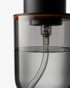 Close-up of the smoked transparent soap reservoir and internal tube