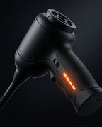 Macro of the cleaning tool's trigger, battery indicator lights and USB-C port