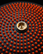 Close-up of the brass inflation valve at the center of the balance disc