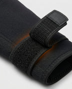 Macro of the adjustable hook-and-loop velcro strap on the elbow sleeve