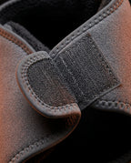 Close-up of the adjustable hook-and-loop Velcro strap on the grey massager wrap