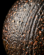 Macro of the speckled volcanic glaze texture on the ceramic burner