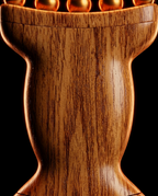 Macro of the curved wood grain handle showing natural rings and hourglass shape