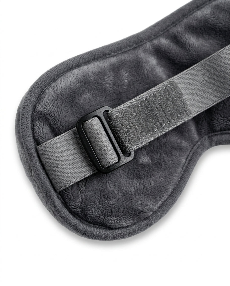Macro of the adjustable elastic strap and buckle on the back of the eye mask