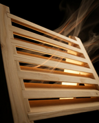 Backlit sauna grille with steam flowing through the slats to show airflow