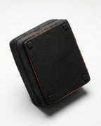 Underside of the foot rest showing the non-slip base with rubber grip feet