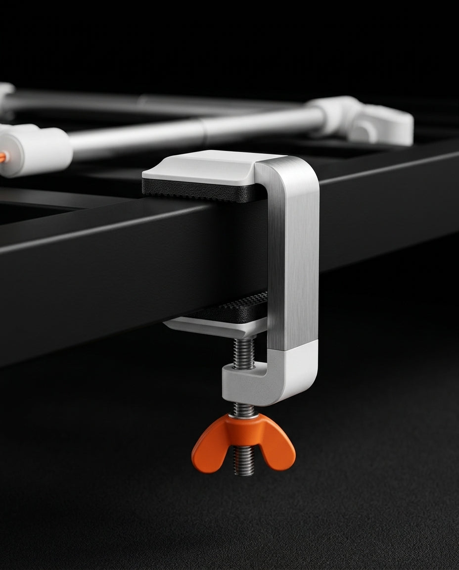 Macro of the C-clamp base with orange wing screw gripping a bed frame rail