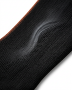 Macro of the four-way stretch compression knit fabric of the ankle sleeve