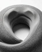 Macro of the contoured inner curve of the grey U-shaped travel neck pillow
