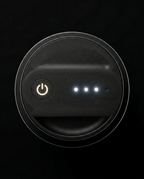 Top view of the dispenser power button and three white LED level lights