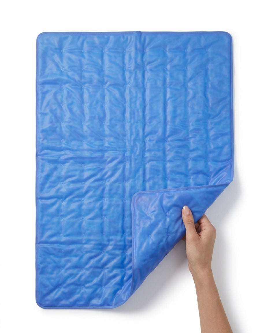 Hand lifting a corner of the flexible blue gel pad to show its pliability